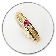 Three interlocked rings from 18k gold with ruby