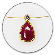 Pendant with ruby drop in 24k gold and champaign-coloured brilliant in 18k gold on goldplated steel chain 